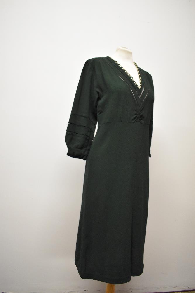 A 1930s bottle green day dress, having ladder work to sleeves and bodice, with cream twist detail to - Image 5 of 6