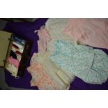 A large collection of vintage underwear and nightwear, including nylon slips, petticoats, knickers