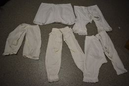 Five pairs of Victorian and Edwardian bloomers/ undergarments, some requiring drawstrings.