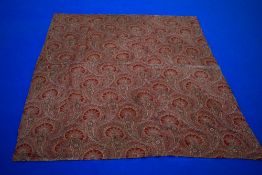 A vivid Victorian hand stitched turkey red Paisley quilt or throw, having sack cloth backing,