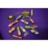 A collection of vintage needle, thimble and spool cases, also included is a tape measure.