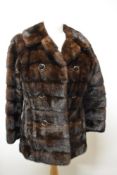 A mahogany coloured mink coat, having faux double breasted button detail and Capstick and Hamer