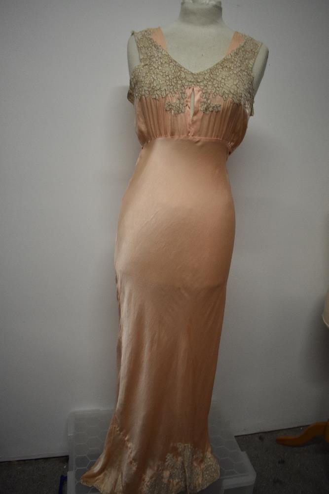 An Art Deco pale pink bias cut nightdress, having beautiful lace to bodice and hem, tie fastening to - Image 5 of 14