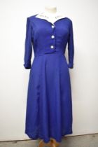 A Royal blue 1940s day dress, having buttons to front, side metal zip and white pique collar.