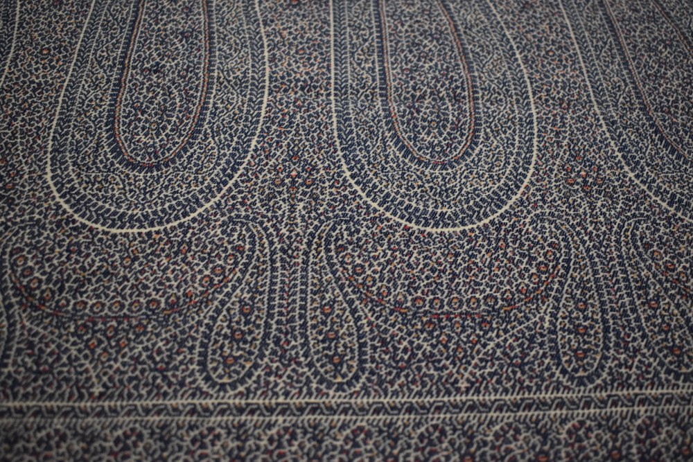 A mid Victorian woven Paisley Kirking crinoline shawl, with cream ground and blue, red and ochre - Image 3 of 10