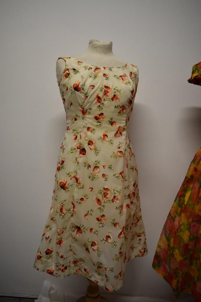 Two 1950s dresses, including vibrant floral dress with full skirt and shawl collar. - Image 3 of 8