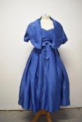 An electric blue satin 1950s strapless evening gown with matching jacket, having boned bodice,