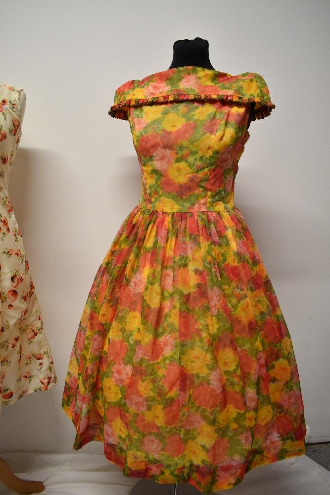 Two 1950s dresses, including vibrant floral dress with full skirt and shawl collar. - Image 2 of 8