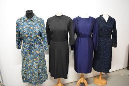 Four late 1950s to 1960s day dresses, medium to larger sizes.