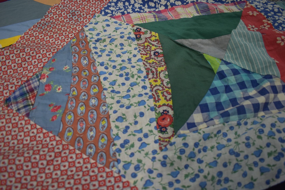 A vintage unfinished / unbacked patchwork coverlet, using bright floral and patterned fabric ( - Image 8 of 8