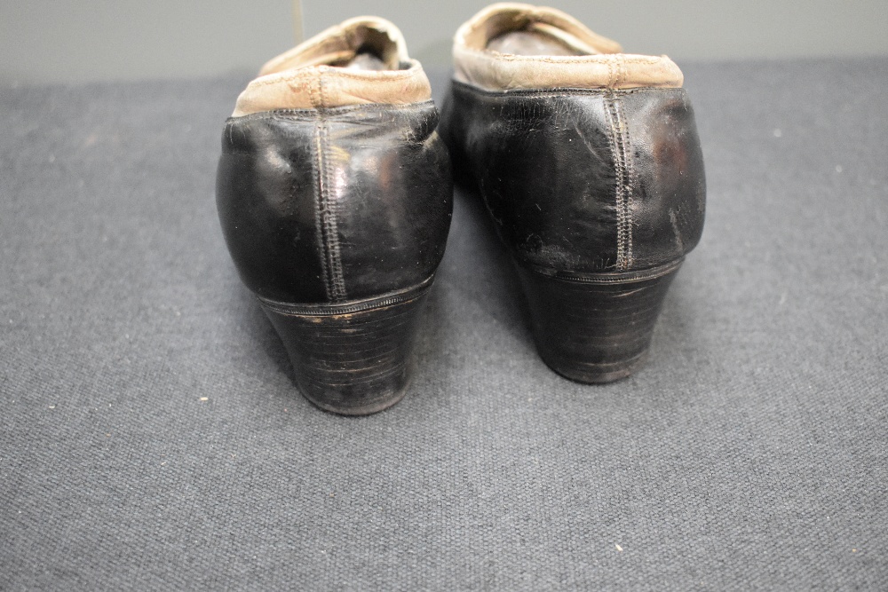 A pair of early 20th century black leather and cream suede shoes, having button decoration and stack - Image 5 of 8