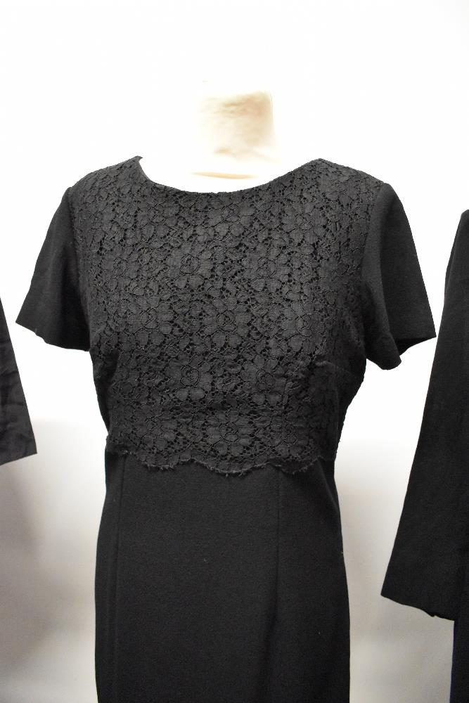 A 1950s black dress with pleated skirt and two 1960s wiggle dresses. - Image 3 of 4