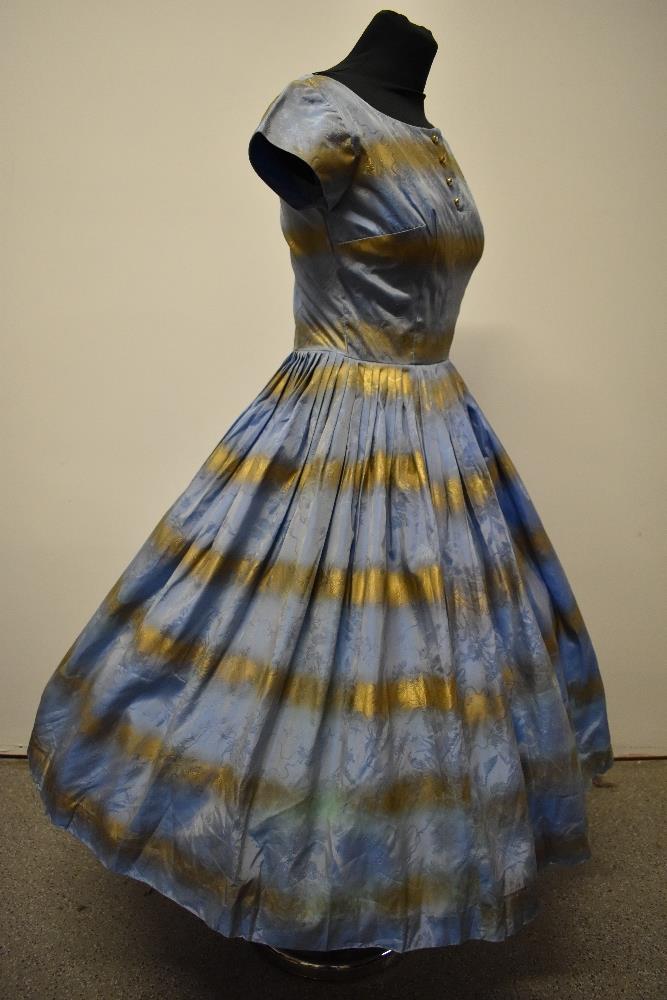 A 1950s blue and gold dress, having full pleated skirt, diamante accents to bodice and rear metal - Image 7 of 8