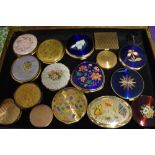 A collection of vintage compacts, including Stratton, some novelty designs, such as cats,