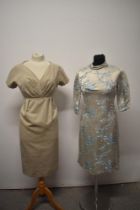 Two 1960s day dresses, including beige dress with pleated bodice and dove grey dress with blossom