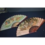 Three early to mid century vintage paper fans, one having Spanish flamenco dancer scene, another