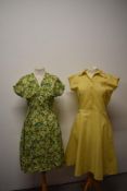 A late 1940s multi coloured floral day dress, having V neckline and gathered skirt and bust, sold