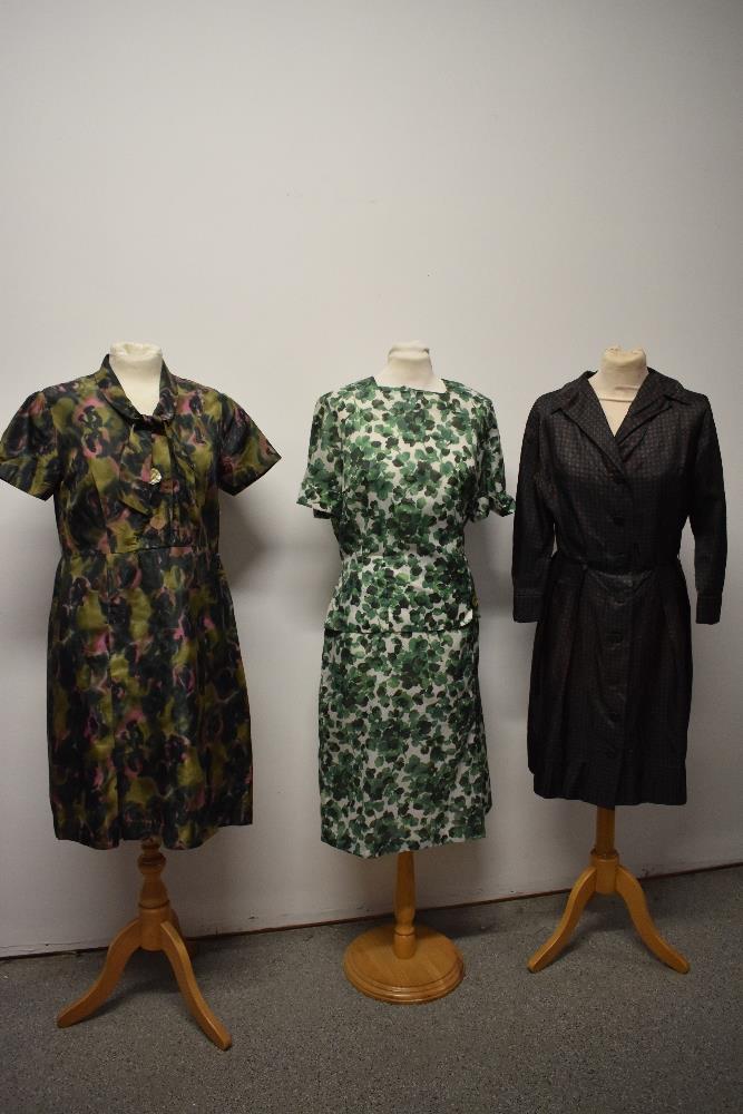 Three vintage 1960s dresses, including abstract patterned day dress with bow to neckline and big