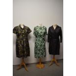 Three vintage 1960s dresses, including abstract patterned day dress with bow to neckline and big