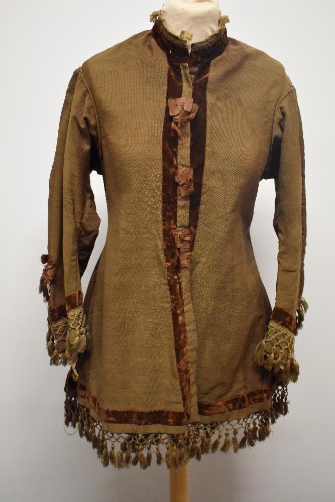 A Brown Victorian overcoat, having velvet trim, tassels to hem and sleeves and silk bow details ( - Image 8 of 17