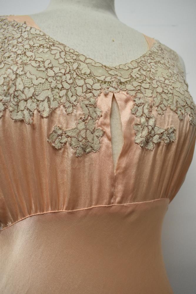 An Art Deco pale pink bias cut nightdress, having beautiful lace to bodice and hem, tie fastening to - Image 14 of 14