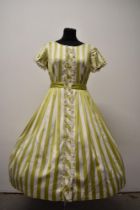 A 1950s polished cotton day dress, having pistachio green and white striped pattern, with tie