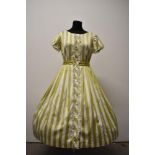 A 1950s polished cotton day dress, having pistachio green and white striped pattern, with tie