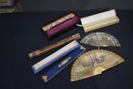 A 19th century fan of bone or similar and another similar with hand painted floral design, also