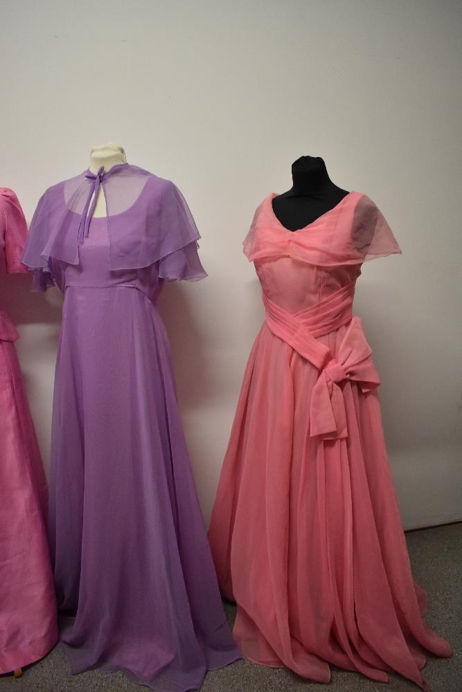 A 1950s pink evening gown with full skirt, a 1960s pink gown with bows to bodice and a 1970s John - Image 2 of 5