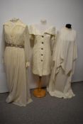 Two 1970s maxi dresses and a cream lace 1980s dress with stiffened collar.