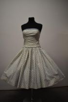 A 1950s Horrockses fashions strapless cotton day dress, having boned bodice, incredibly full