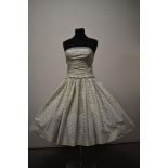 A 1950s Horrockses fashions strapless cotton day dress, having boned bodice, incredibly full