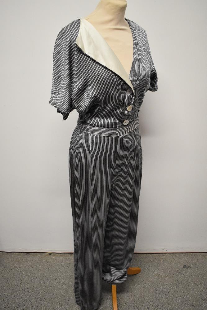 A silky striped vintage jump suit, having contrasting lapel and wide legs. - Image 3 of 7