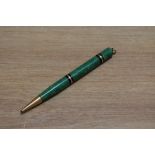 A Mabie Todd Swan ring top propelling pencil with two gold on black band (142/50) in jade green