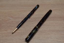 A Mabie Todd & Co Swan SM2/58 lever fill fountain pen and propelling pencil set in green, gold and