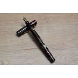 A Mabie Todd & Co 205/62 leverless twist fill fountain pen wine and silver with narrow band to the