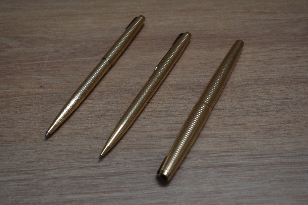 A Parker 65 Consort Insignia converter fill fountain pen, propelling pencil and ballpoint pen set in