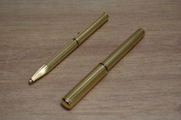 A Sheaffer Grand Connoisseur aerometric fill fountain pen and ballpoint set in gold with striped