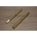 A Sheaffer Grand Connoisseur aerometric fill fountain pen and ballpoint set in gold with striped