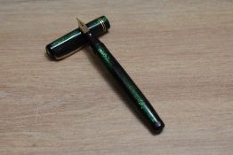 A Mabie Todd & Co Swan leverless twist fill fountain pen in green lizard skin with two narrow