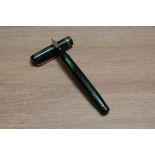 A Mabie Todd & Co Swan leverless twist fill fountain pen in green lizard skin with two narrow