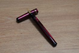 A Mabie Todd & Co Swan leverless twist fill fountain pen in burgundy lizard skin with one narrow