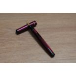 A Mabie Todd & Co Swan leverless twist fill fountain pen in burgundy lizard skin with one narrow