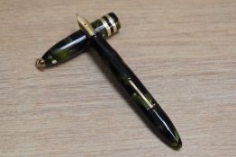 A Sheaffer Lifetime Balance Petite lever fill fountain pen in marine green with white spot, ring top