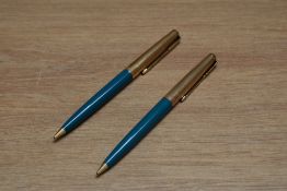 Two Parker 61 propelling pencils in turquoise with rolled gold caps