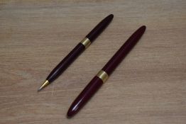 A Sheaffer Statesman snorkel fill fountain pen and propelling pencil set in burgundy with white spot