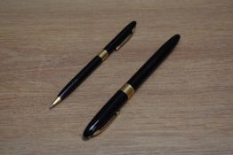 A Sheaffer Statesman Snorkel fill fountain pen and propelling pencil set in black with white spot