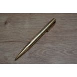 A Mabie Todd & Co Fyne Poynt propelling pencil in yellow metal. Engraved