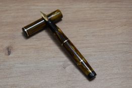 A Mabie Todd & Co Swan 330/64 leverless twist fill fountain pen in brown amber having Swan 3 14CT