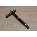 A Mabie Todd & Co Swan 1500 eye dropper fountain pen in Black Hard Rubber with broad band to the top